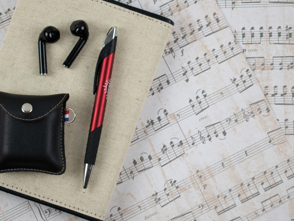 Crescendo promotional pen with ear buds and sheets of music
